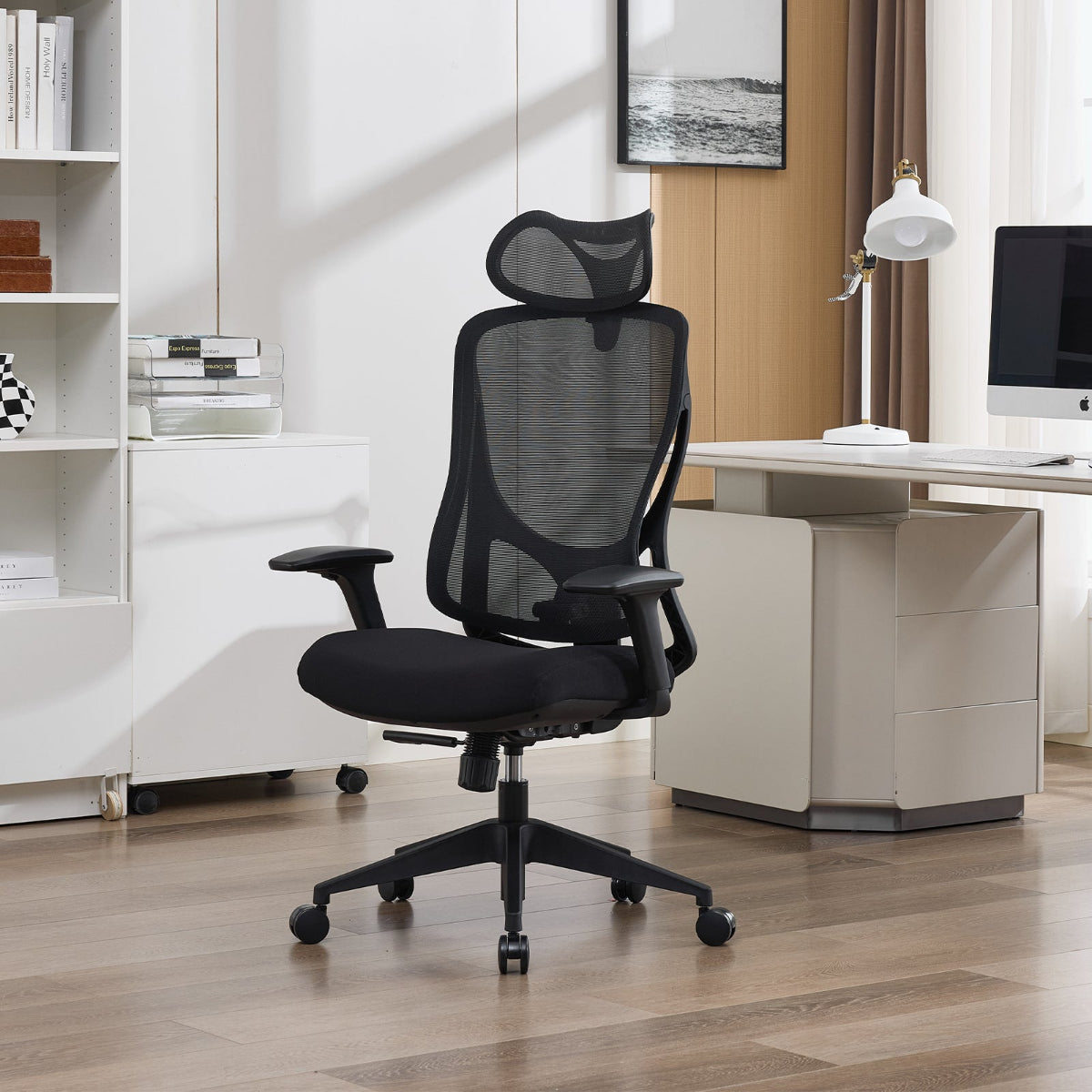 NHO-0026BL,Black office chair in a modern office setting with a desk and books.