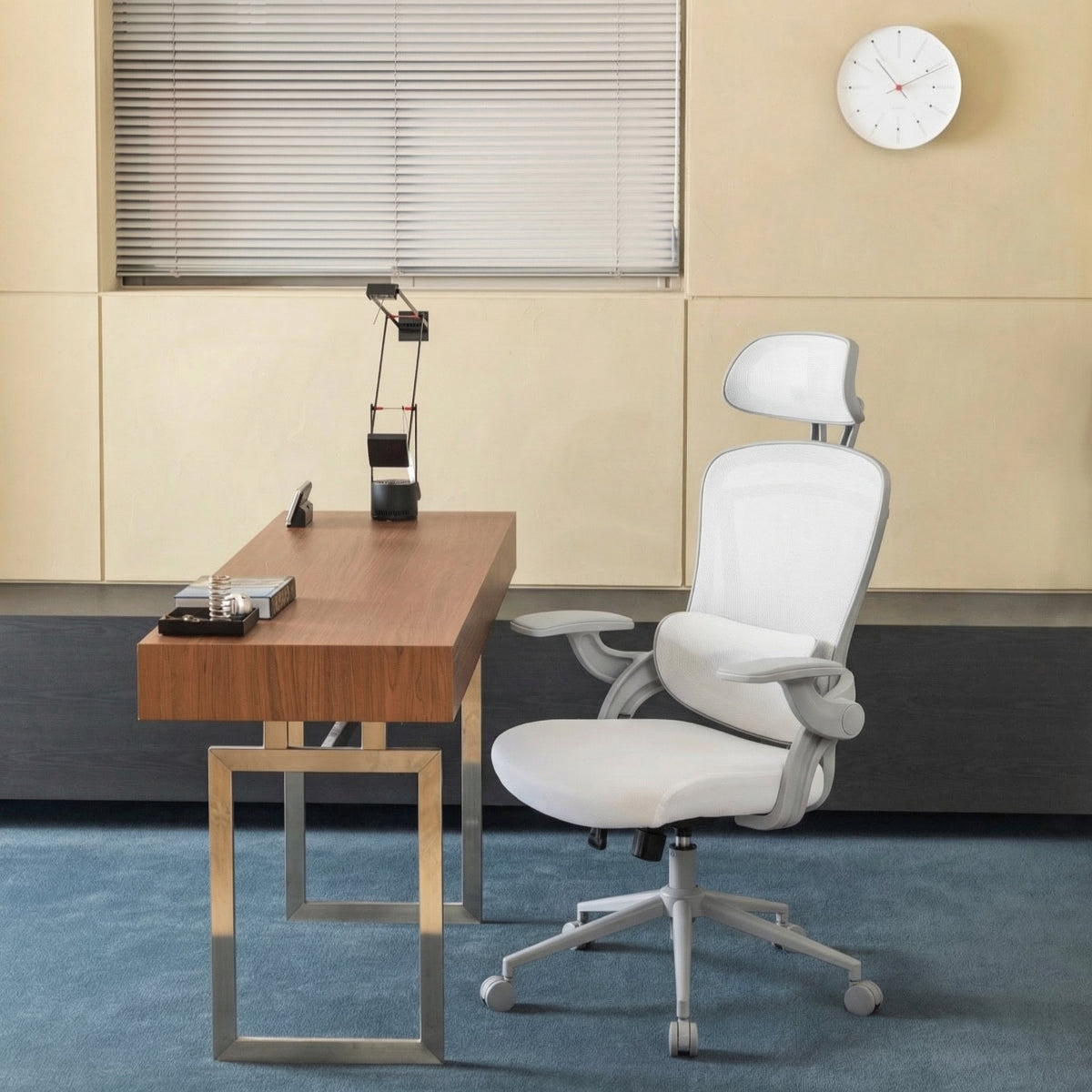 NHO-0013WH,White office chair in front of a wooden desk with a clock on the wall.