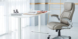 The Taupe Posture Ergonomic PU Leather Office Chair in an office building