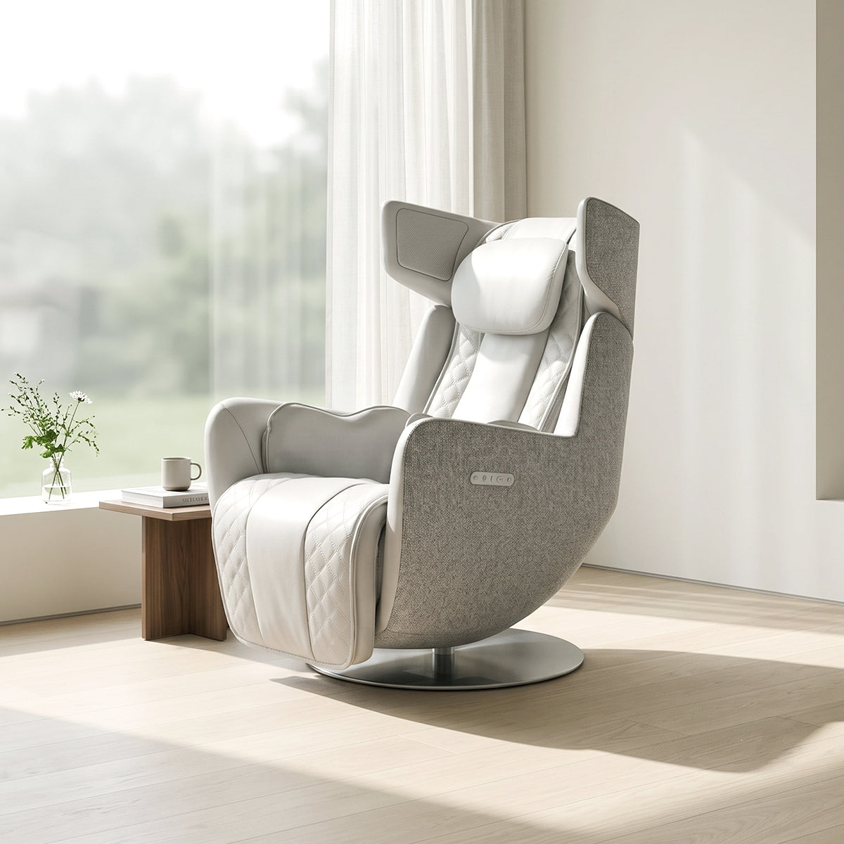 N-0005EW-V2, Elder White ergonomic massage armchair in a bright, modern American living room during a sunny daylight saving time afternoon. The elegant off-white leather and light grey fabric lounger rests on light hardwood floors, featuring quilted detailing on the leg rest and a circular metallic pedestal base. In the background, warm natural sunlight streams through a large window with sheer curtains, illuminating a small wooden side table with a mug and a glass vase with green flowers on the windowsill.