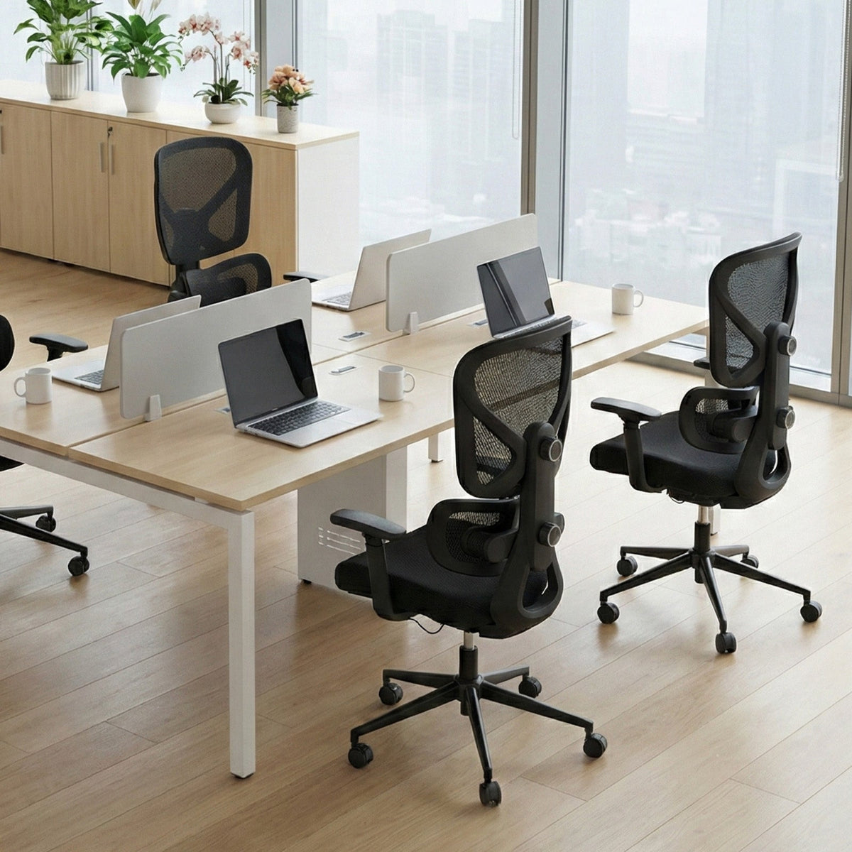 NH0-0023BL,Modern office setup with desks, chairs, and laptops in a bright room.