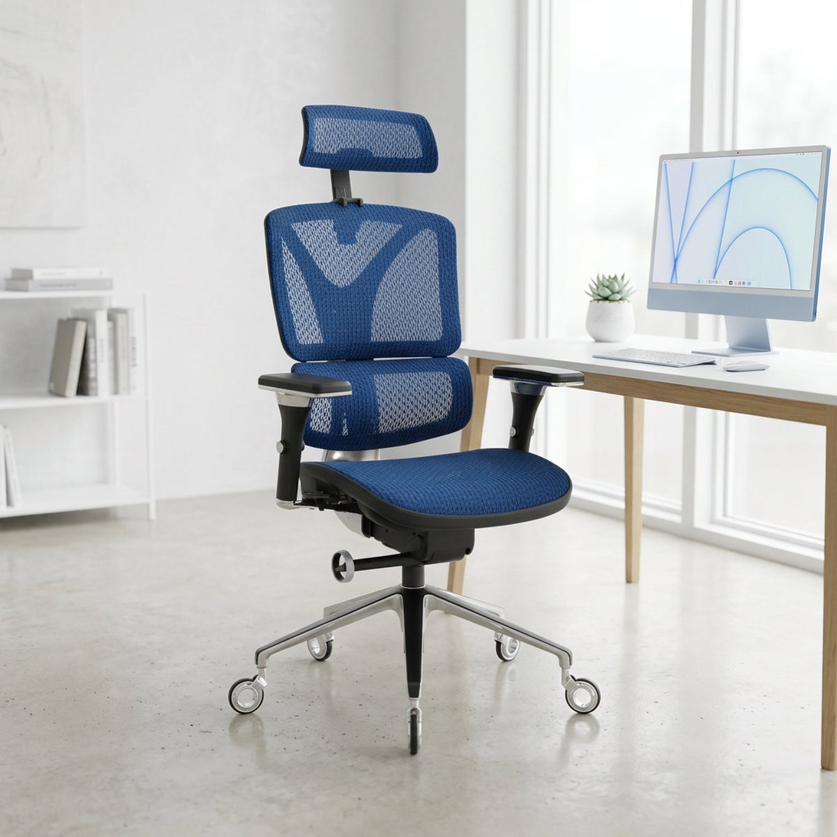 NHO-0005BU,Brilliant Blue ergonomic chair in a modern office setting with a computer desk and monitor.